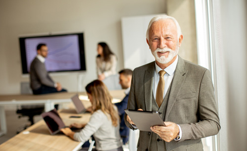 A happy and smiling senior businessman