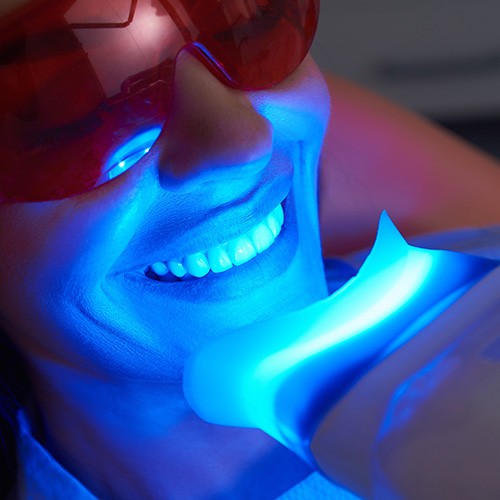 Woman receiving in-office teeth whitening in Columbia, MO