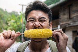 Man eating corn on the cob